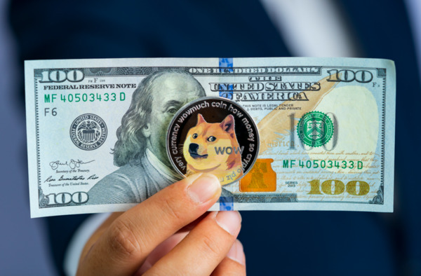 US 100 dollar bill and dogecoin symbol.